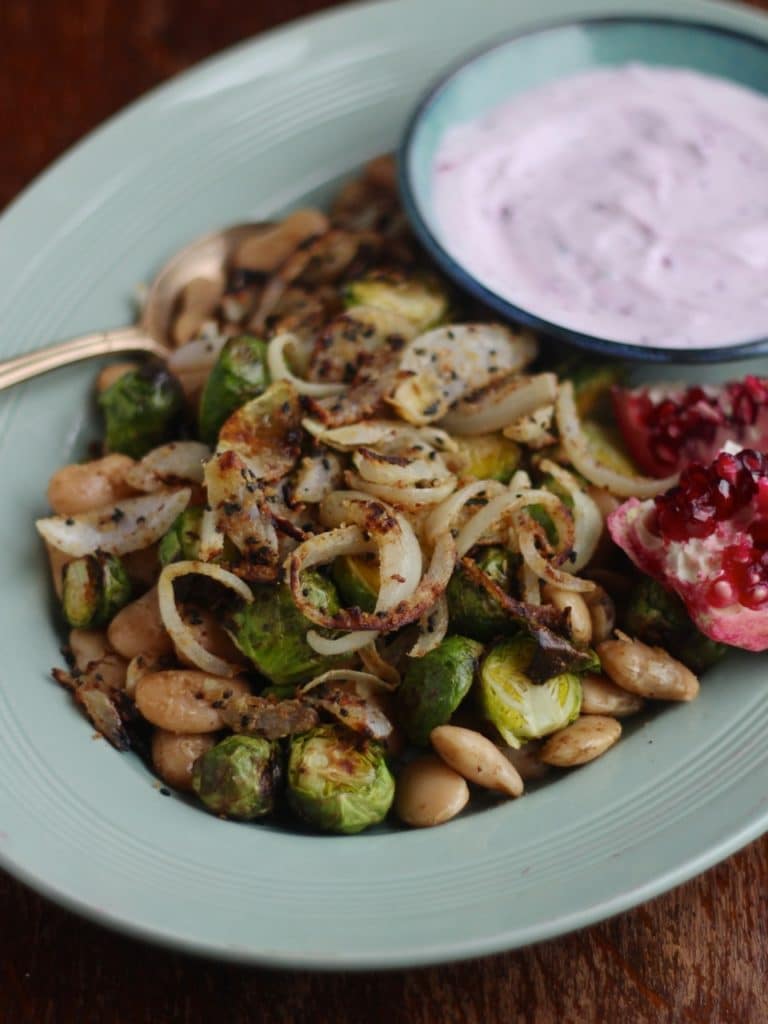 Warm Winter Salad: Brussels & Butter Beans with Nigella Seed Crispy Onions & Hibiscus Raita, a simple winter salad recipe, gluten free vegetarian (and vegan options) by Natural Kitchen Adventures
