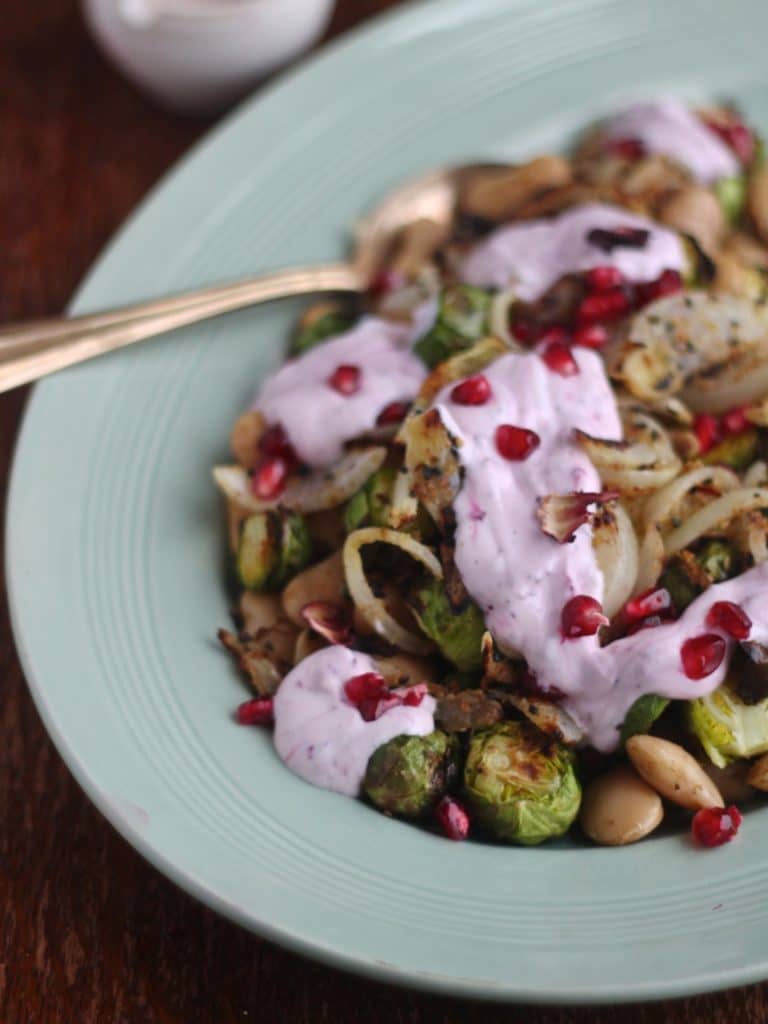 Warm Winter Salad: Brussels & Butter Beans with Nigella Seed Crispy Onions & Hibiscus Raita, a simple winter salad recipe, gluten free vegetarian (and vegan options) by Natural Kitchen Adventures