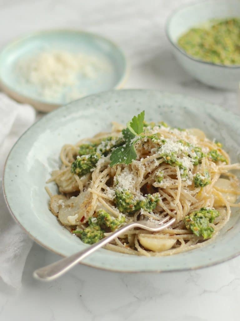 A simple vegetarian pasta dish with sautéed Jerusalem Artichokes, Spaghetti, hazelnut parsley pesto, and lots of grated Parmesan | Natural Kitchen Adventures 