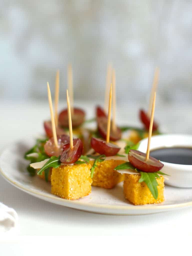 Parmesan Polenta Bites with Rocket & Grape, a Christmas canapé on Natural Kitchen Adventures, gluten free