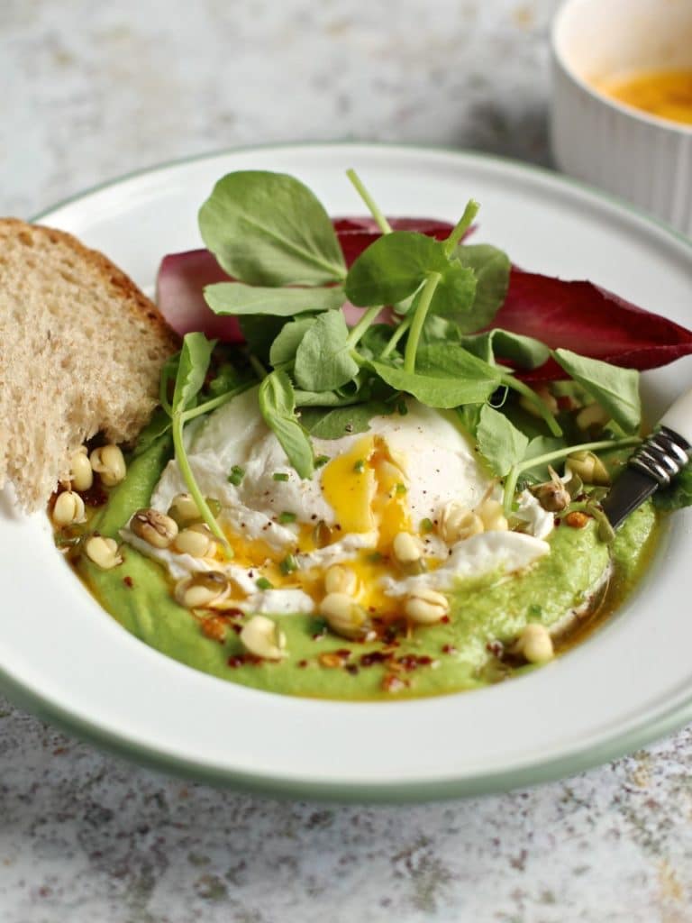 A riff on Turkish Eggs, with a base of Pea Puree, Poached Egg, Chilli Butter and Pea Shoots. Vegetarian. Spring